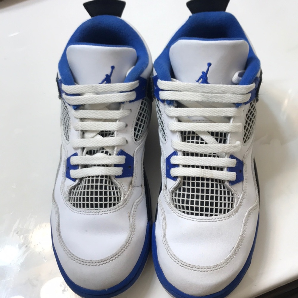 royal blue and white Air Jordan sneakers